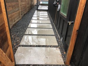 Backyard concrete pathway with large squares